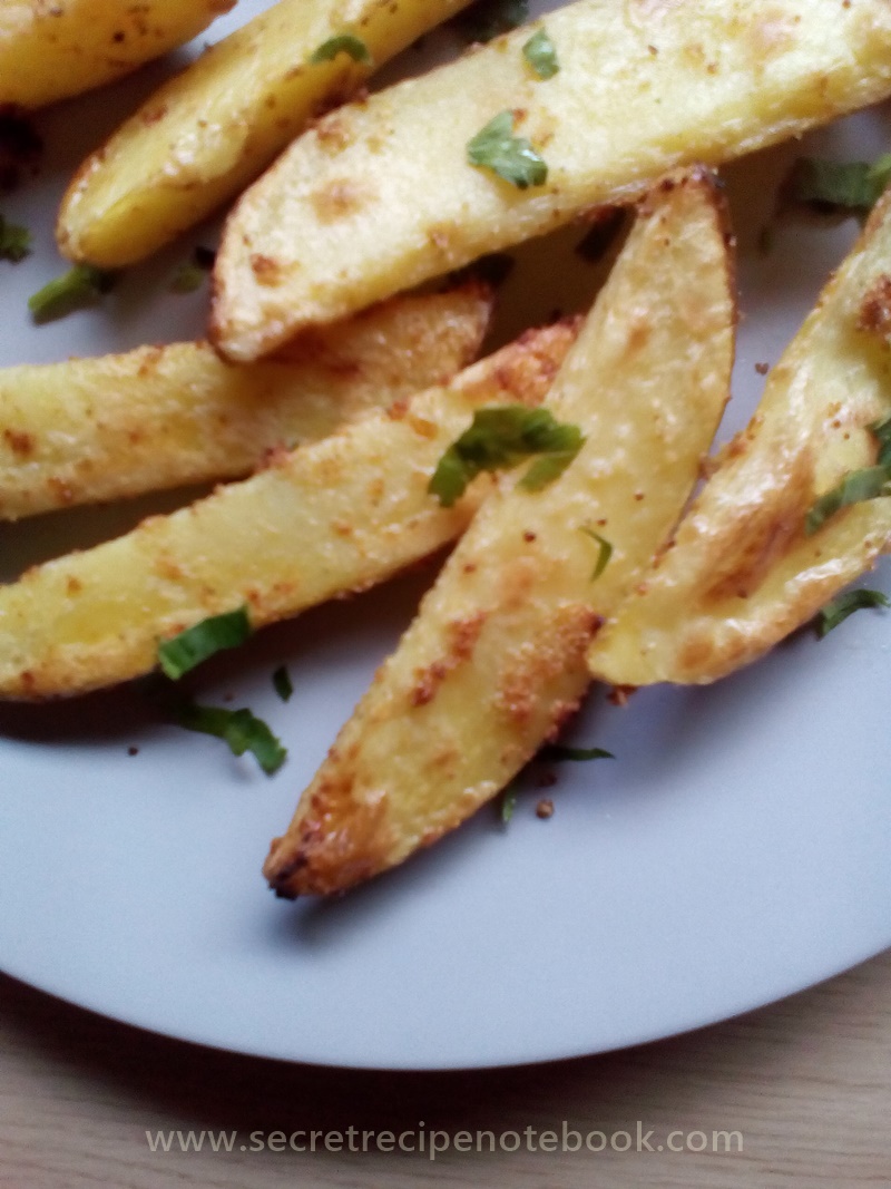 baked garlic potato wedges plate